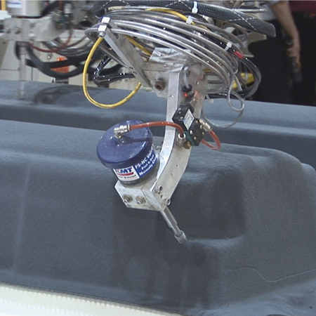 KMT Waterjet robotic trimming cell for the automotive industry