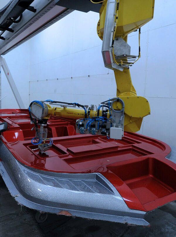 KMT waterjet cutting fiberglass boat